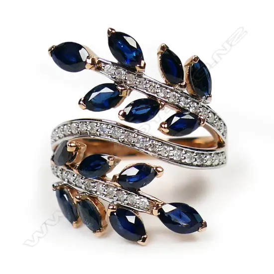 A 14ct rose gold sapphire and diamond fern style ring,