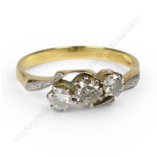 An early 20thC18ct gold three stone diamond ring,