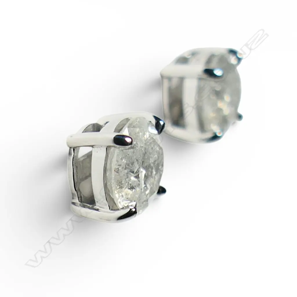 A pair of 14ct white gold and diamond stud earrings, Image 1++