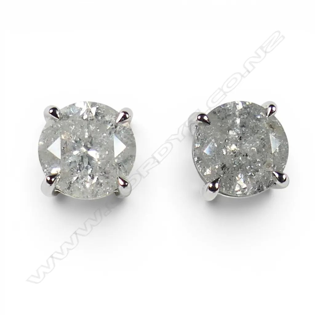 A pair of 14ct white gold and diamond stud earrings, Image 1++