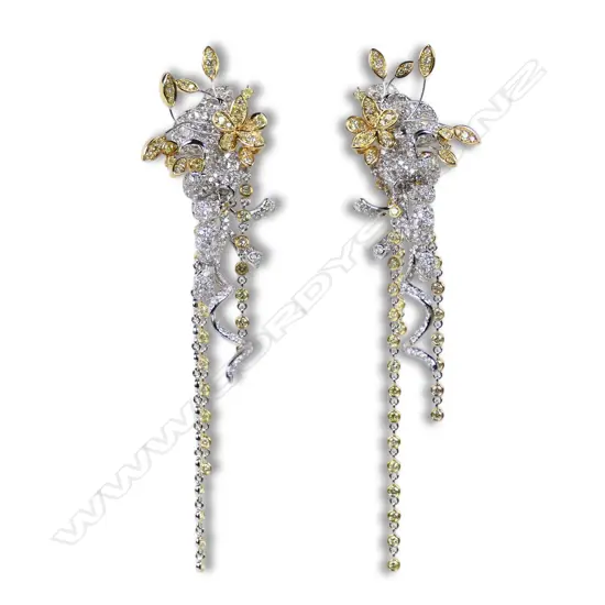A pair of 18ct white gold yellow and white diamond chandelier style earrings,