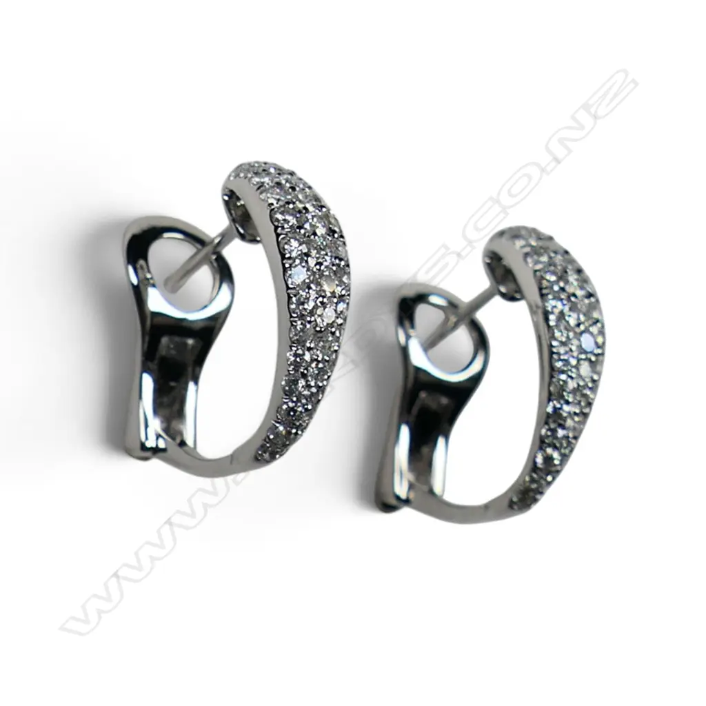 A pair of 18ct white gold and diamond earrings, Image 1++
