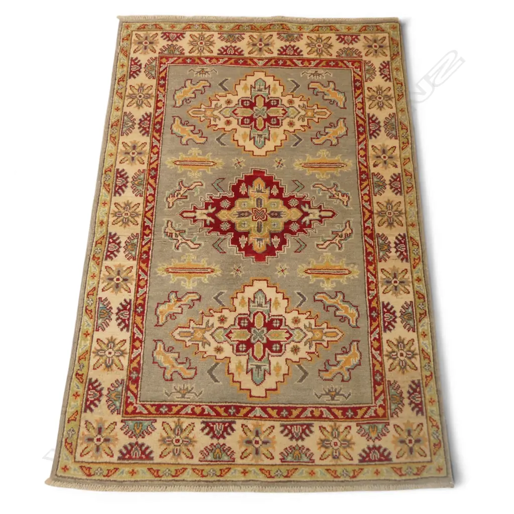 A hand-knotted Kazak rug, Image 1++
