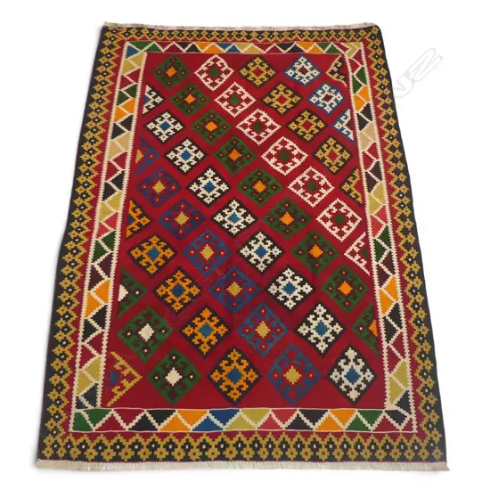 A hand-woven Persian Kilim rug,