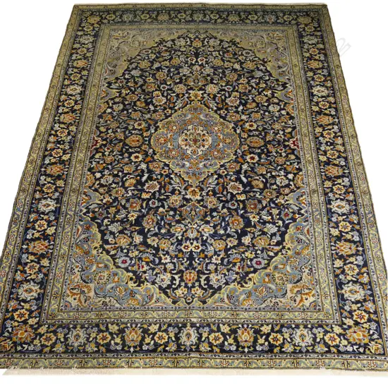 A large hand-knotted Persian carpet,