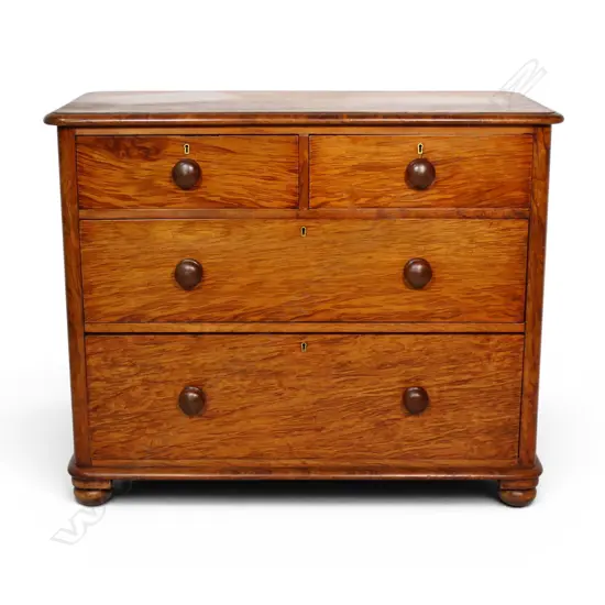 A colonial mottled kauri chest of drawers,