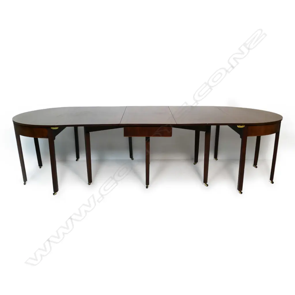 A George III three-section D-end mahogany extension banquet dining table, Image 1++