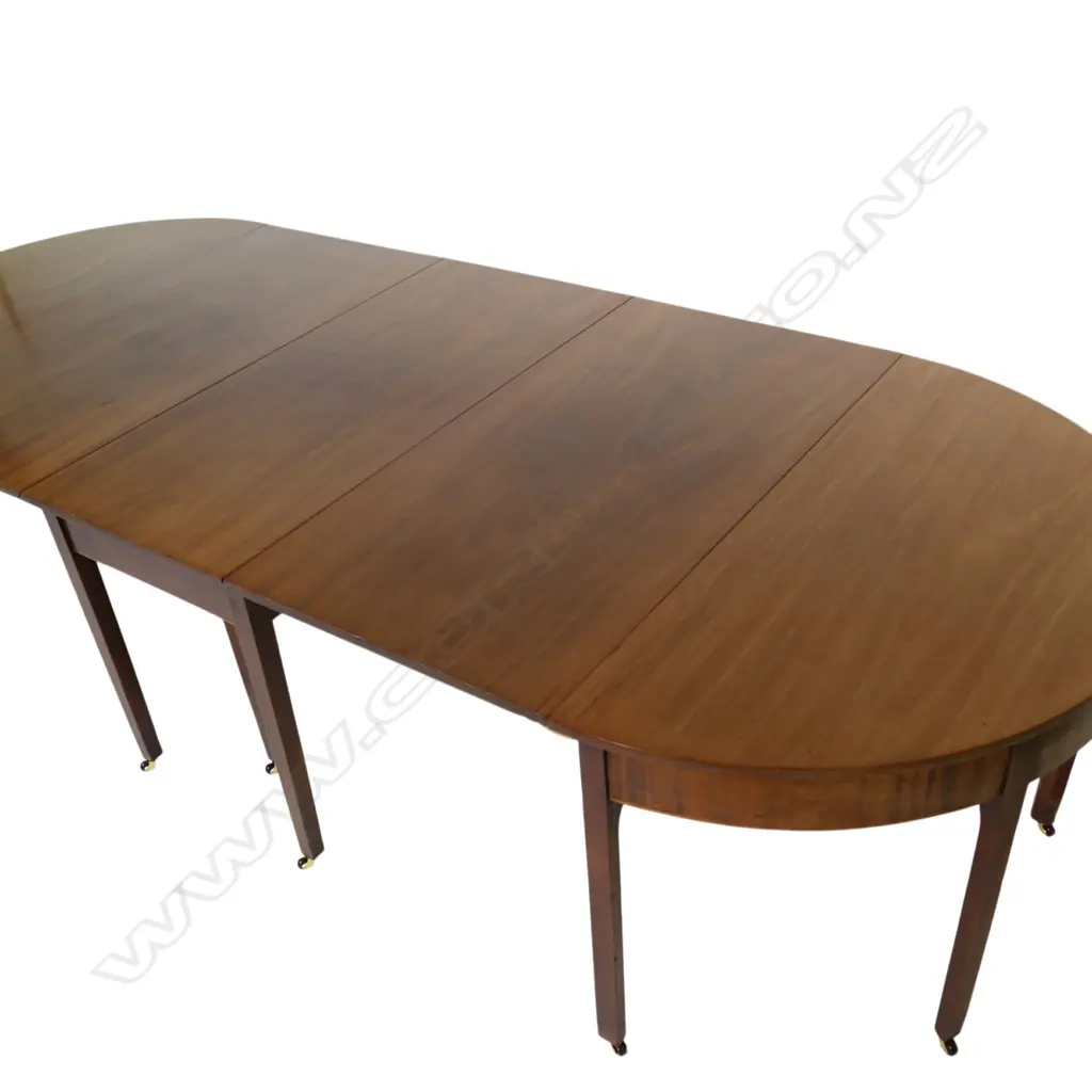 A George III three-section D-end mahogany extension banquet dining table, Image 1++