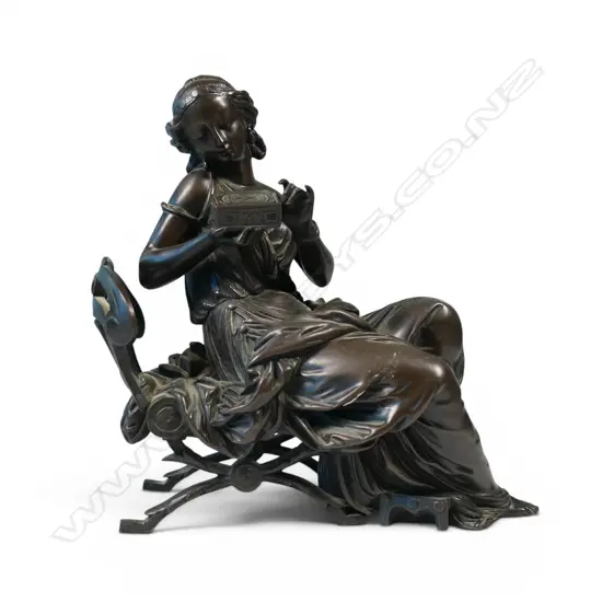 A bronze sculpture of a classical lady,
