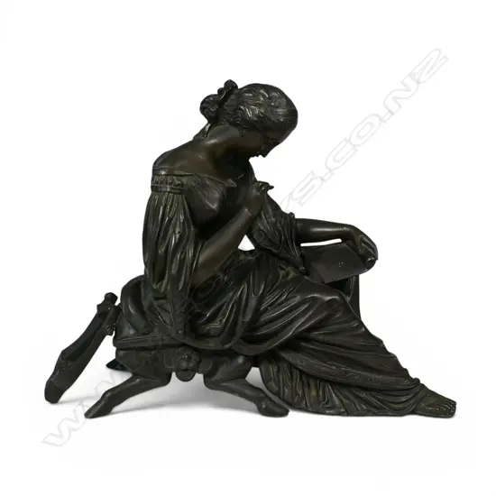 A bronze sculpture of a classical lady,