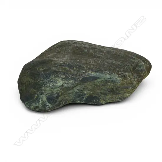 A large and heavy river worn pounamu (serpentinite) boulder,