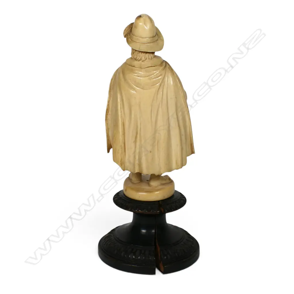 A 19thC European finely caved ivory figure of an itinerant musician with a hurdy-gurdy, Image 1++