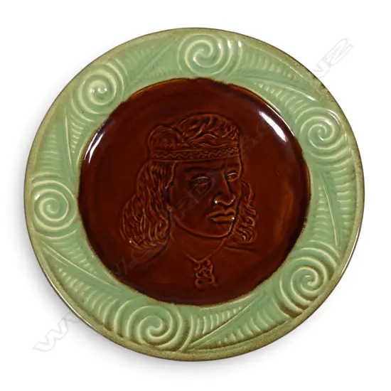 A Crown Lynn Wharetana ware wall plate 'Puhi Urutapu Tamahine',