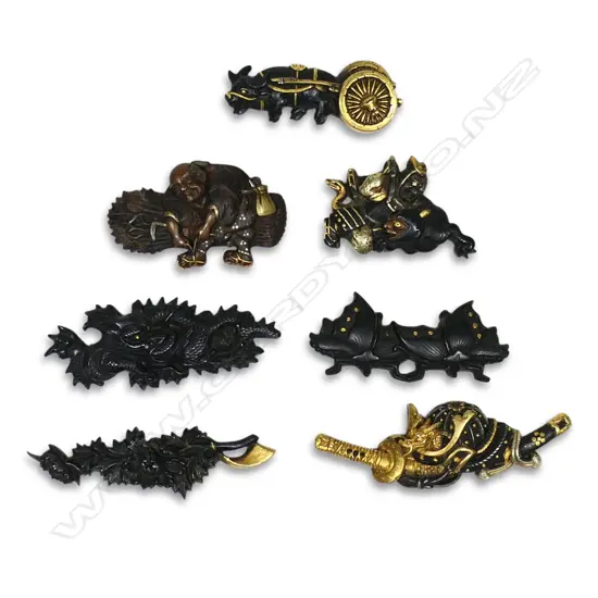 A collection of seven Japanese menuki,