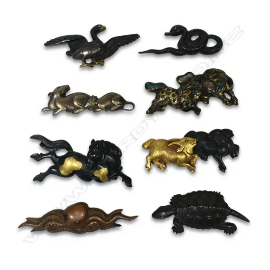 A collection of eight Japanese menuki,