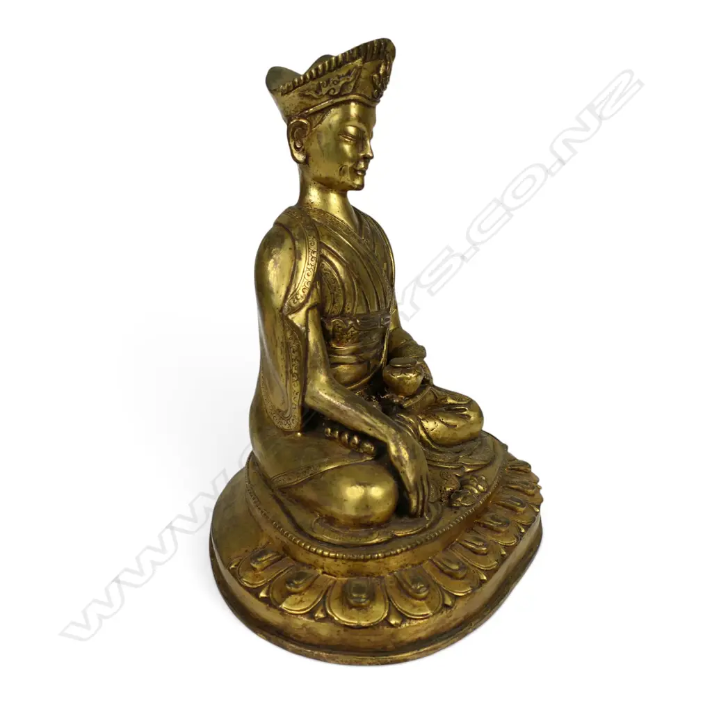 An Oriental gilt bronze buddha, Image 1++