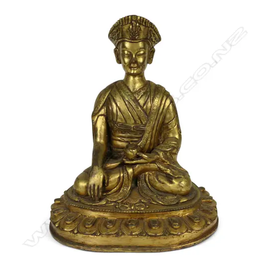 An Oriental gilt bronze buddha,