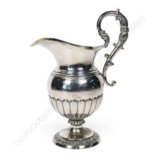 An early 19thC Continental .750 standard silver cream jug,