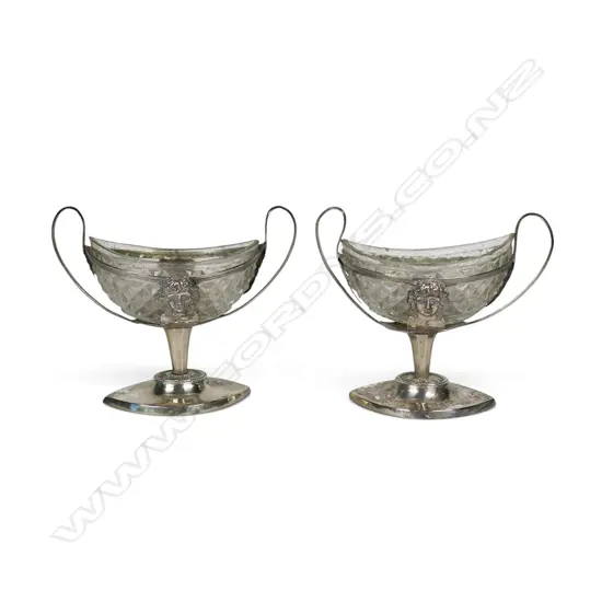 A pair of 19thC Continental silver and glass salts,