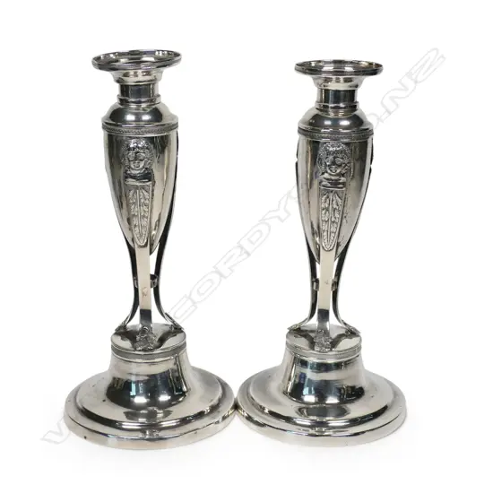 A pair of early 19thC German .800 standard silver candlesticks,