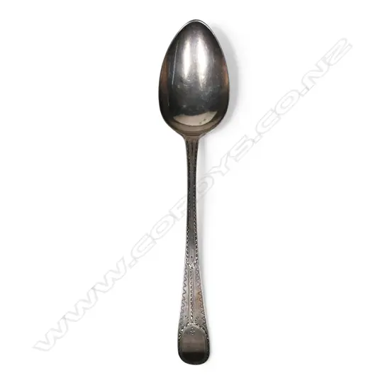 A George III silver bright cut tablespoon,