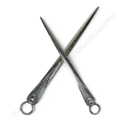 A Victorian silver quality graduated pair of meat skewers,