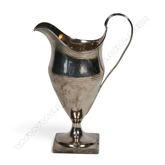 A late George III silver cream jug,