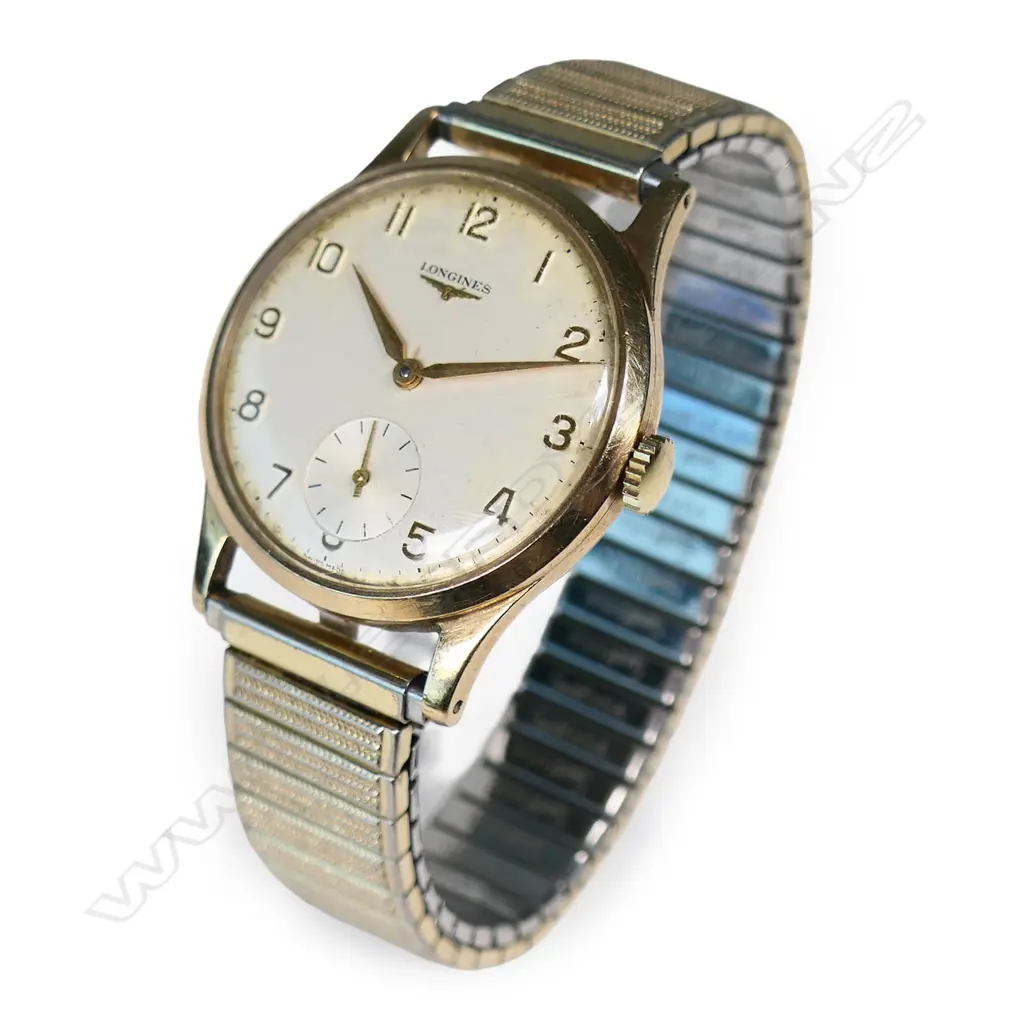 A vintage 9ct gold Longines wrist watch, Image 1++