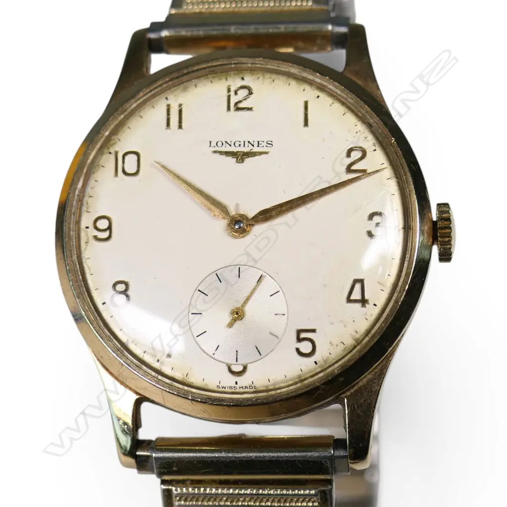 A vintage 9ct gold Longines wrist watch, Image 1++