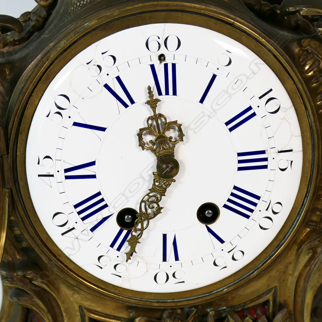 A French Louis XV style brass mantel clock, Image 1++
