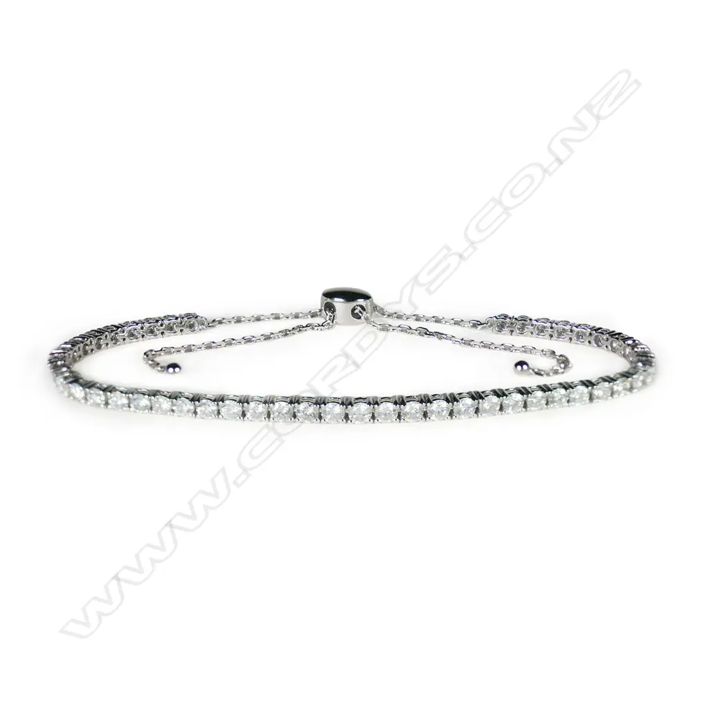 A 14ct white gold and diamond bolo style tennis bracelet, Image 1++
