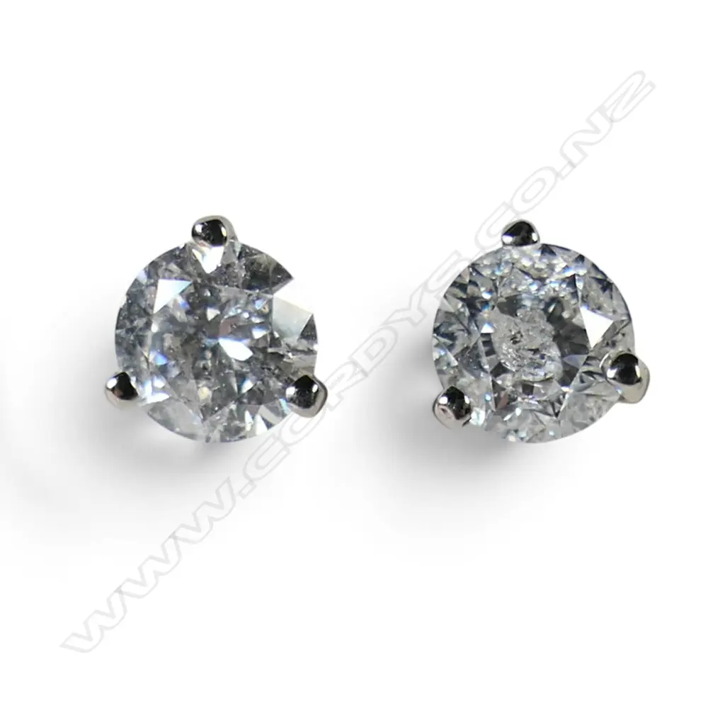 A pair of 14ct white gold and diamond stud earrings, Image 1++