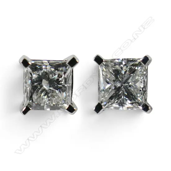 A pair of 14ct white and diamond stud earrings,