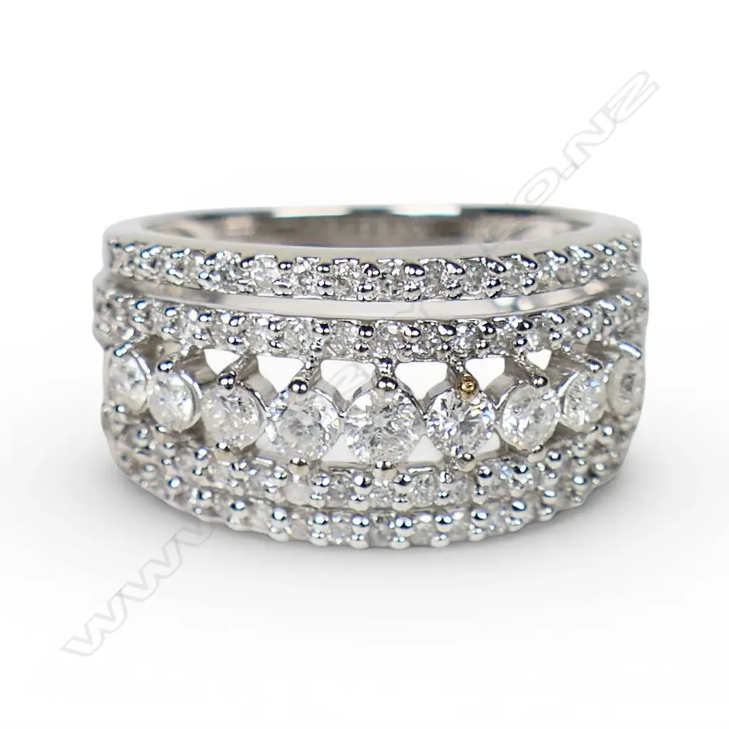 A modern 10ct white gold and multi diamond banded ring, Image 1++