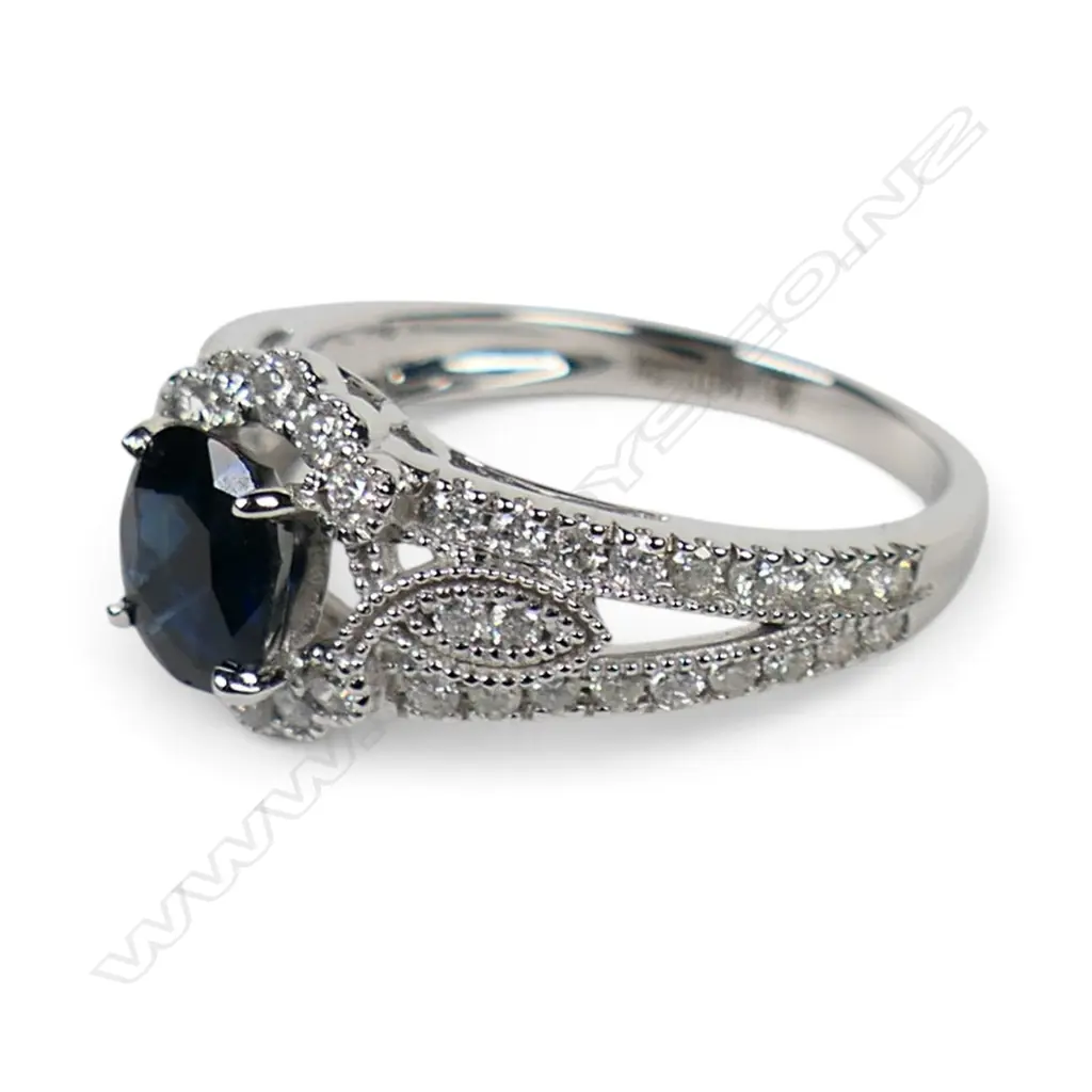 A 14ct white gold and blue Ceylonese Sapphire and diamond dress ring, Image 1++
