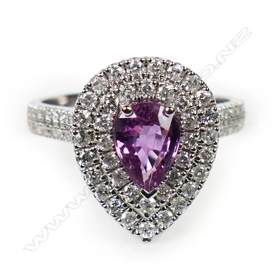 A 14ct white gold pink sapphire and diamond double halo ring,