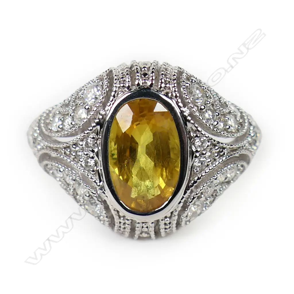 A 14ct white gold yellow sapphire and diamond cluster ring, Image 1++