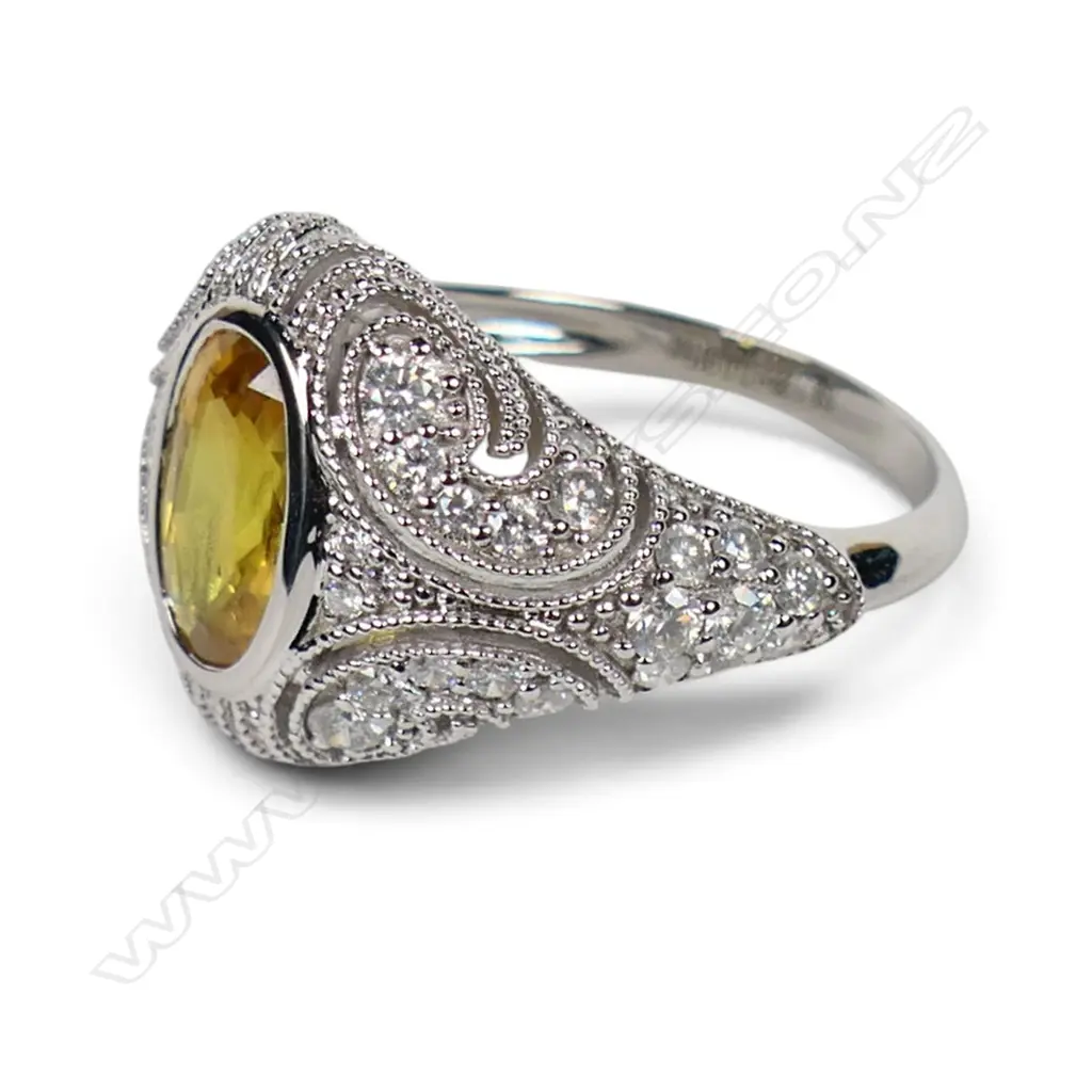 A 14ct white gold yellow sapphire and diamond cluster ring, Image 1++