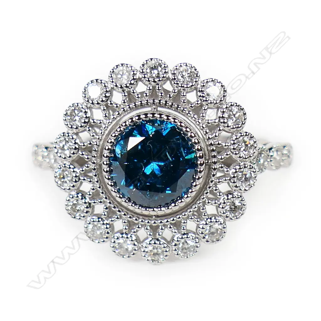 A 14ct gold blue diamond and white diamond halo ring, Image 1++