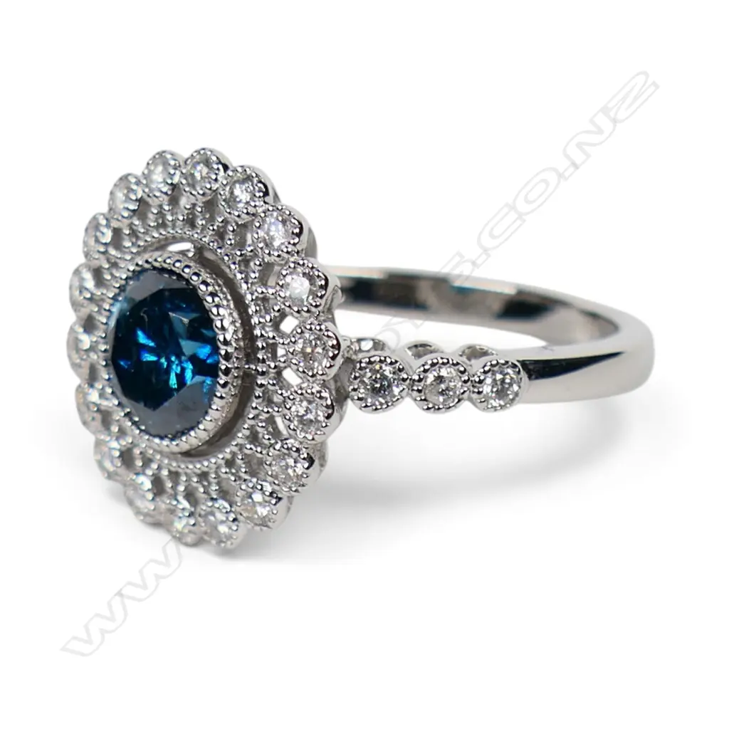A 14ct gold blue diamond and white diamond halo ring, Image 1++