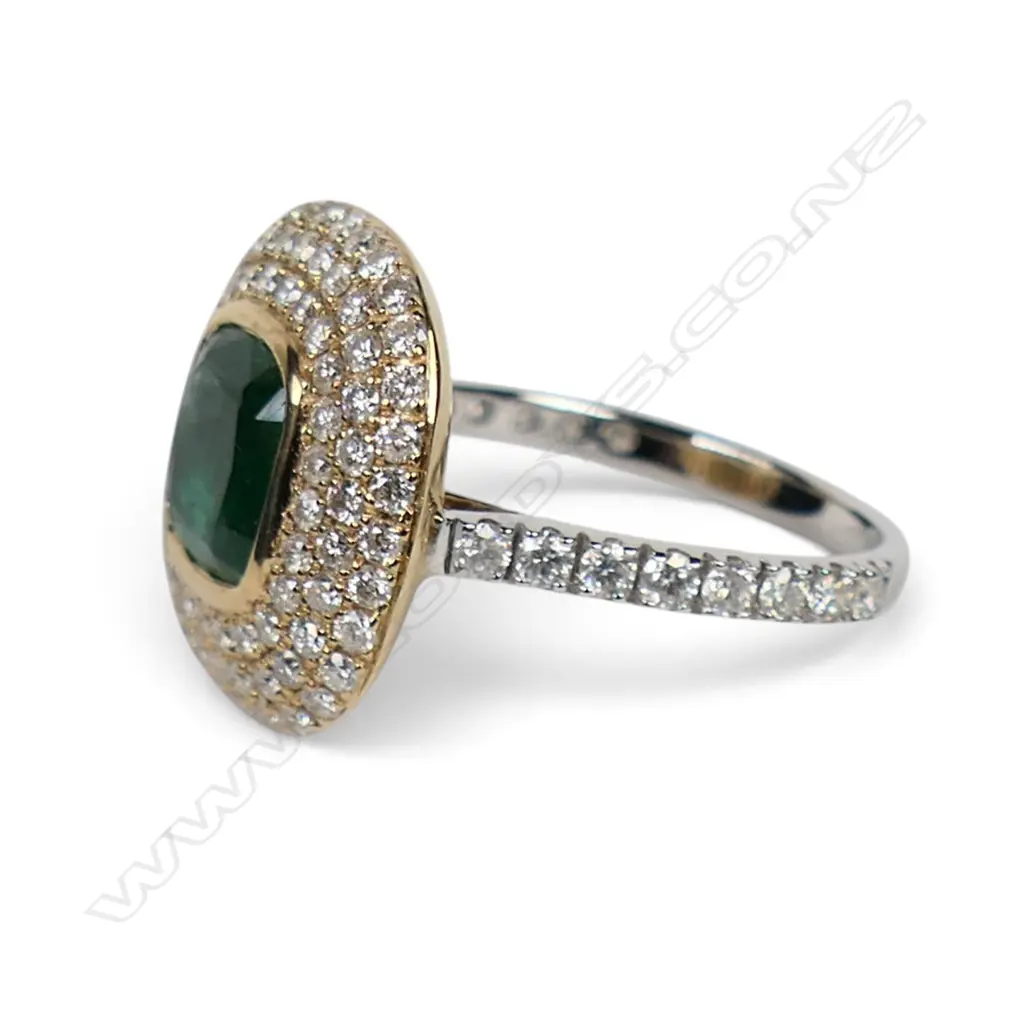 A 14ct white and yellow gold emerald and diamond halo cocktail ring, Image 1++