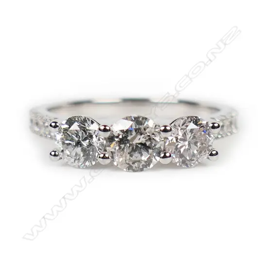 A 14ct white gold and diamond trilogy ring,
