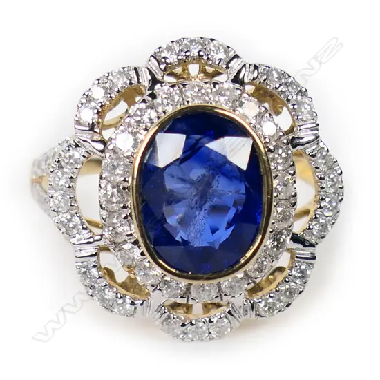 A 14ct gold Ceylonese sapphire and diamond floral style ring,