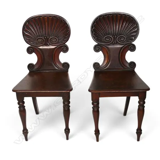 A pair of Victorian mahogany hall chairs,