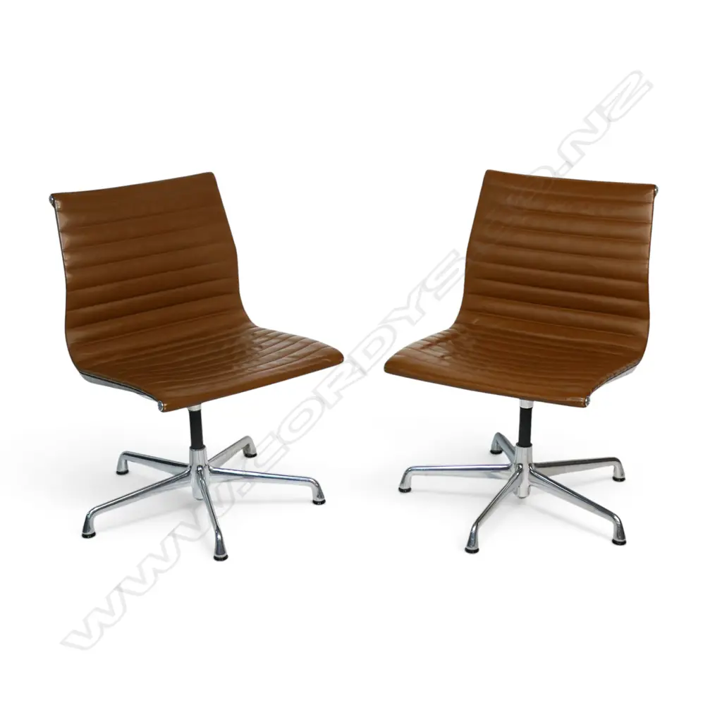 A pair of tan leather Eames conference swivel chairs, Image 1++