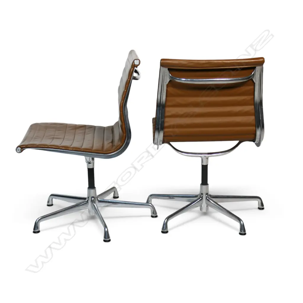A pair of tan leather Eames conference swivel chairs, Image 1++