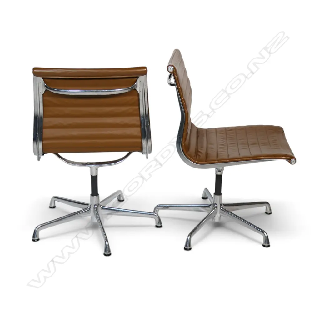 A pair of tan leather Eames conference swivel chairs, Image 1++