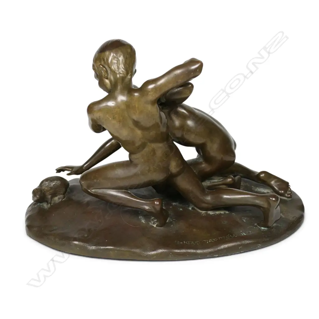 A bronze sculpture of boys wrestling a mole, Image 1++