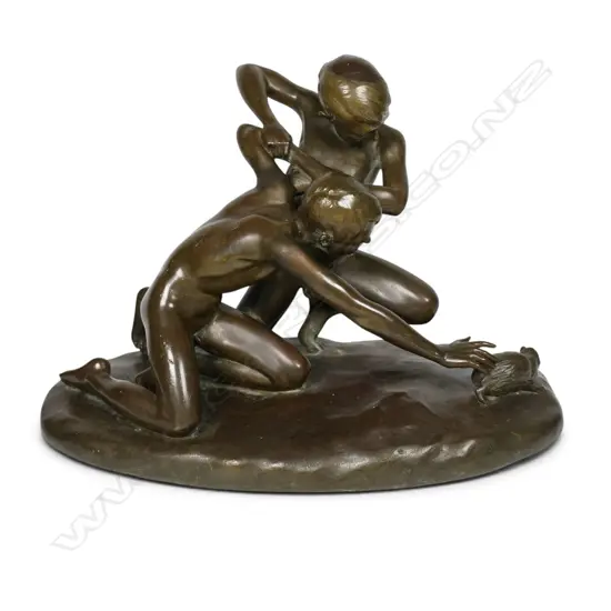 A bronze sculpture of boys wrestling a mole,