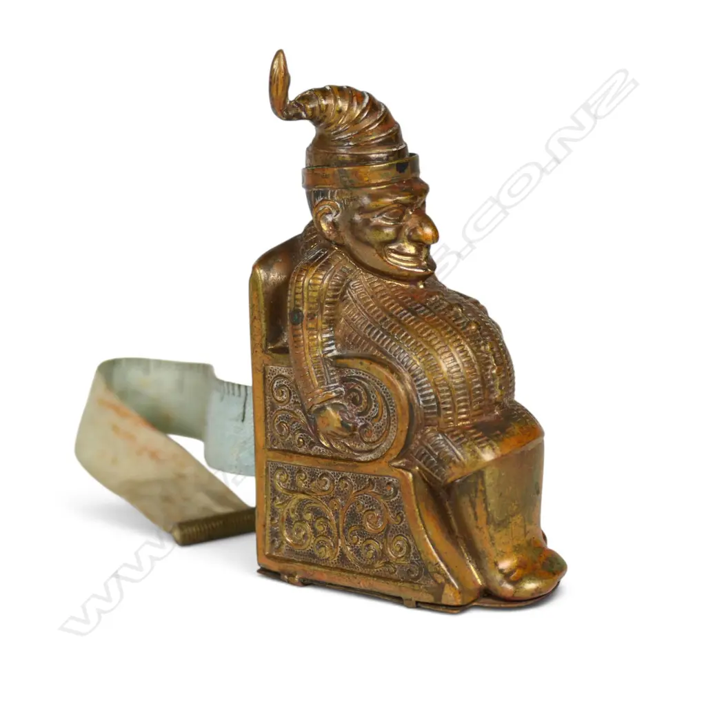 A c.1900 gilt brass Punch sewing tape measure, Image 1++